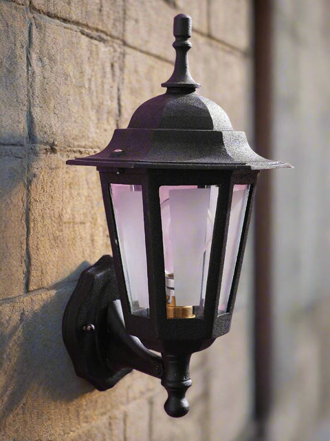 Tatva Lights Frosted Glow outdoor wall light featuring a matte black frame and frosted glass diffuser, providing a soft ambient illumination for modern outdoor spaces.