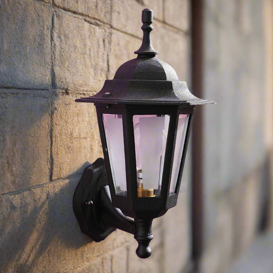 Tatva Lights Frosted Glow outdoor wall light featuring a matte black frame and frosted glass diffuser, providing a soft ambient illumination for modern outdoor spaces.