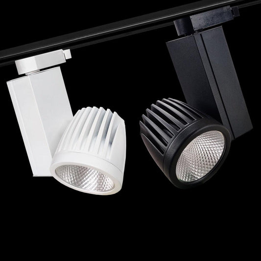 atva Lights black and white LED COB track lights with ribbed cylindrical housing – modern directional ceiling spotlights for commercial, gallery, or retail lighting applications.