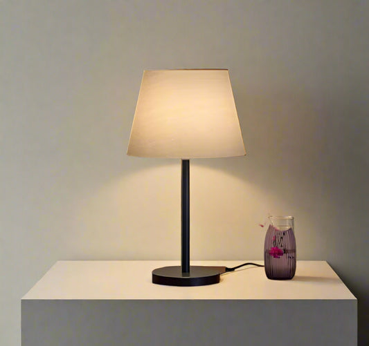 Tatva Lights Luxury Black Table Lamp with a matte black finish, sleek metallic accents, and a modern minimalist silhouette—ideal for bedside tables, work desks, or contemporary living spaces.