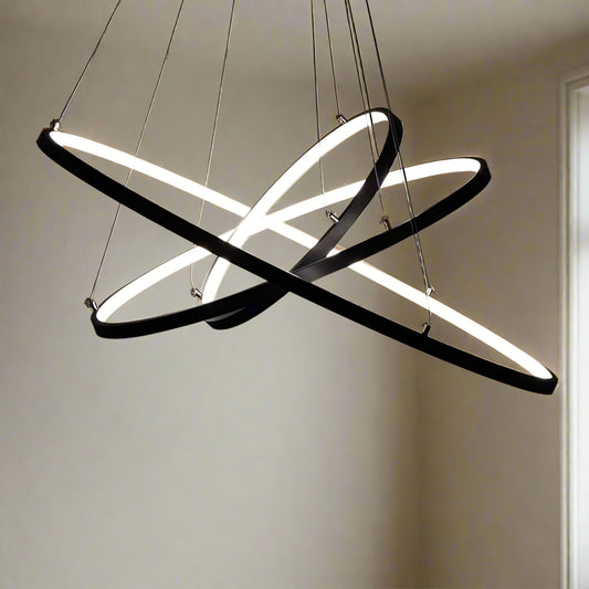 Tatva Lights Modern Zenith Chandelier – striking contemporary chandelier with a bold geometric structure and integrated LED lighting, finished in elegant gold. Perfect for high ceilings, luxury dining areas, and statement living room décor.