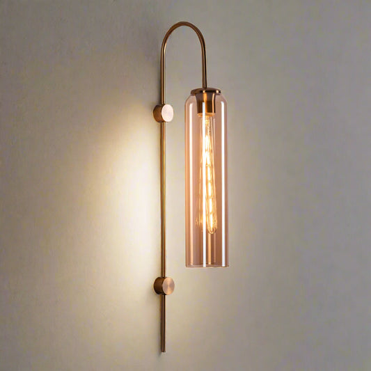 Tatva Lights Modern gold wall light with elongated glass shade and exposed Edison bulb – sleek contemporary sconce for ambient indoor lighting, ideal for living rooms, bedrooms, and hallways