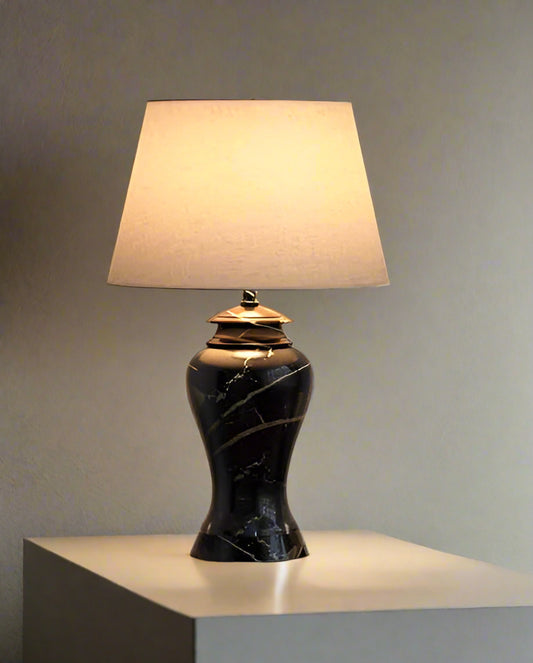 Tatva Lights Nocturra Stone Black Table Lamp – a modern table lamp featuring a textured black stone-finish base with a minimalist silhouette, perfect for bedside tables, study desks, or accent lighting in contemporary interiors.