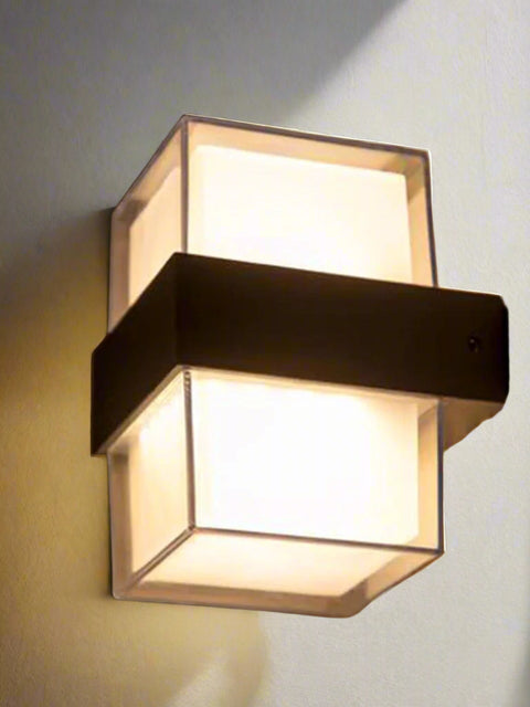 Tatva Lights Radiant Acrylic Outdoor Wall Light with a modern cuboid design, featuring a frosted acrylic diffuser and matte metal band for soft ambient illumination. Ideal for outdoor walls, balconies, and entryways, combining durability with contemporary style.