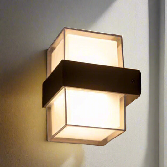 Tatva Lights Radiant Acrylic Outdoor Wall Light with a modern cuboid design, featuring a frosted acrylic diffuser and matte metal band for soft ambient illumination. Ideal for outdoor walls, balconies, and entryways, combining durability with contemporary style.