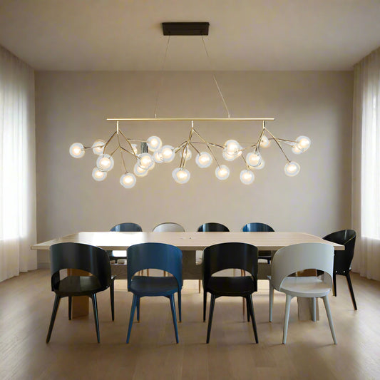 Tatva Lights Écloré Noir Glass Chandelier featuring smoky black glass globes and a sleek gold metal frame with integrated LED lighting—perfect for modern dining areas, living rooms, or upscale interior spaces seeking a bold, elegant touch