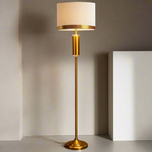 Tatva gold floor lamp with fabric drum shade – modern luxury standing light for living rooms, bedrooms, and reading corners